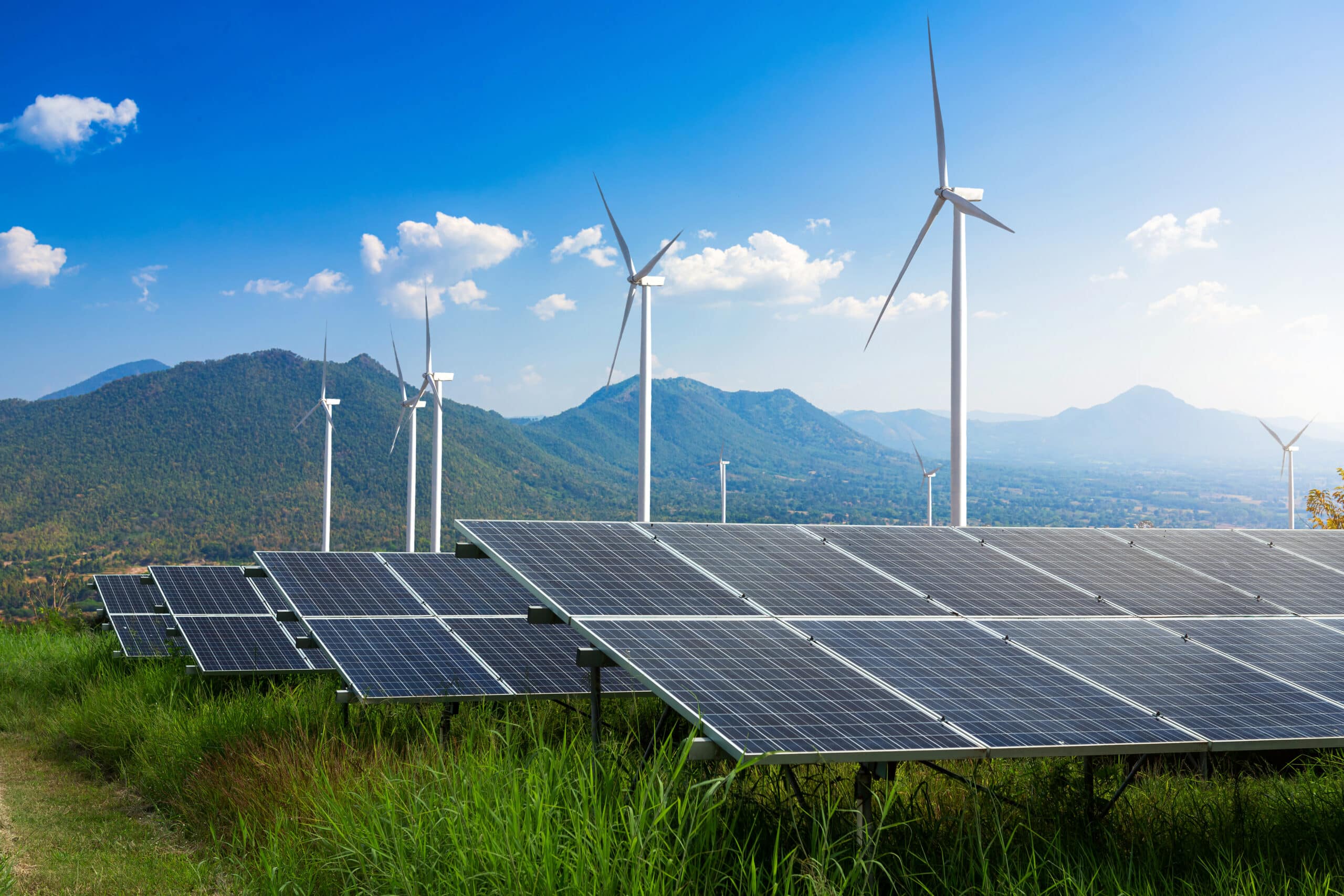 Photovoltaic modules solar power plant with wind turbines agains